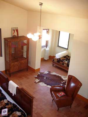 Superior triple with panoramic view, private facilities (bath and shower), and breakfast